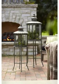 Brand new ⌛ Melrose Lanterns W/Stand (Set Of 2) 32"H, 53"H Metal/Glass 💯